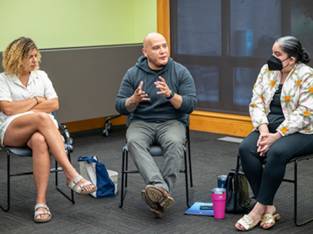 Ángel García, center, a professor of English, led “Writing for Discovery: Self, Public, and Community,” a new pilot summer course offered through the Odyssey Project. (Photo courtesy of Humanities Research Institute.)